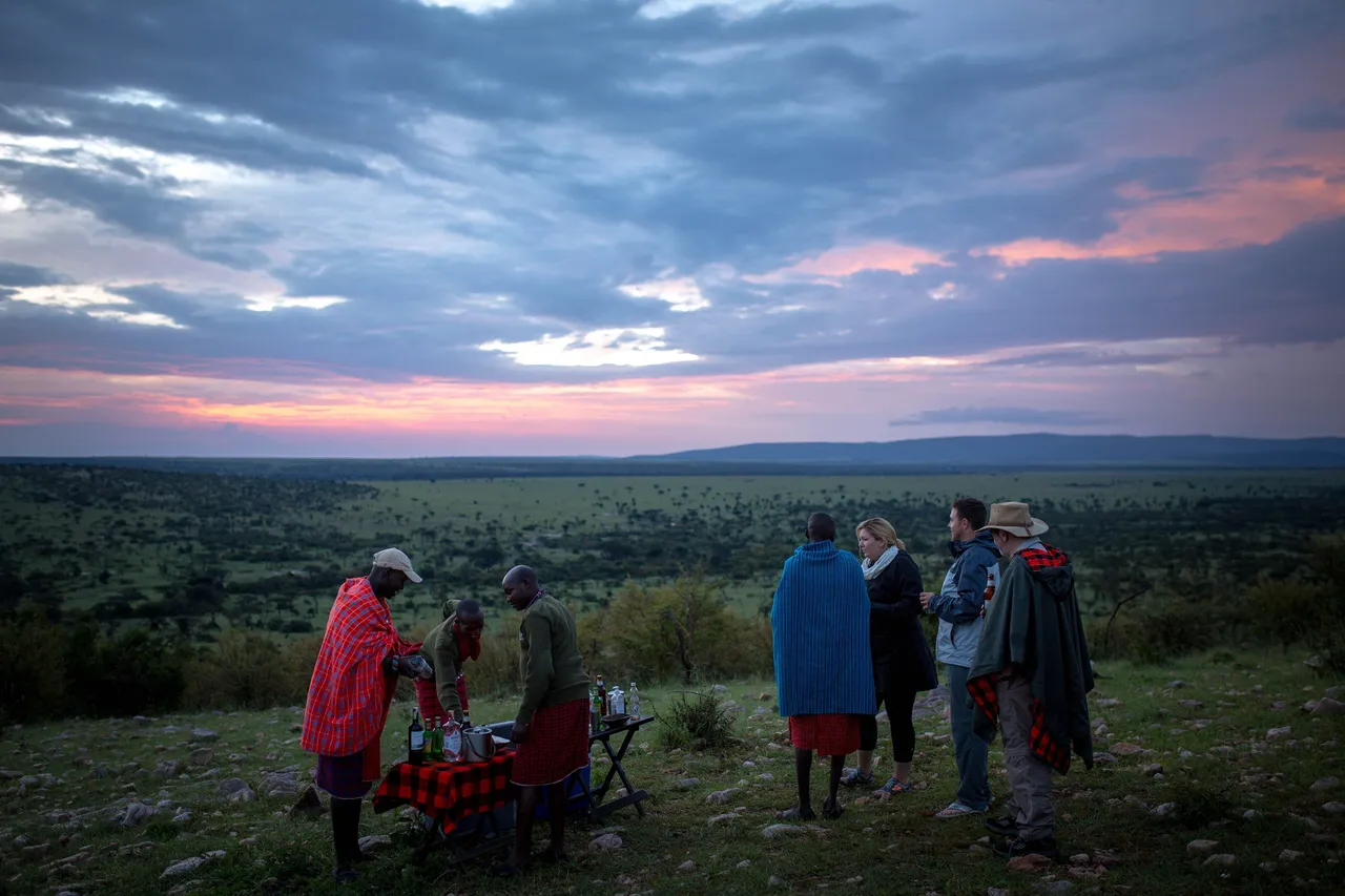 A driver-guide with guests in the Masai Mara